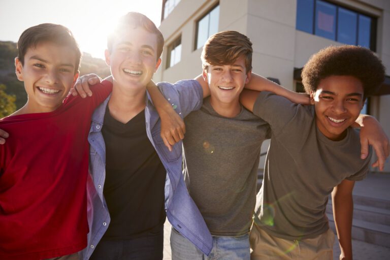 Portrait Of Male High School Student Friends Outside College Buildings